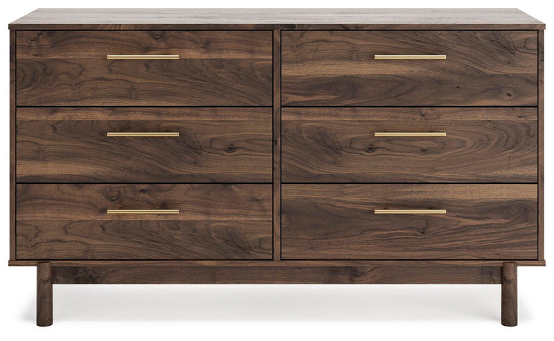 Ashley Furniture Calverson Dresser with sleek wood finish and multiple drawers, shown from a front view.
