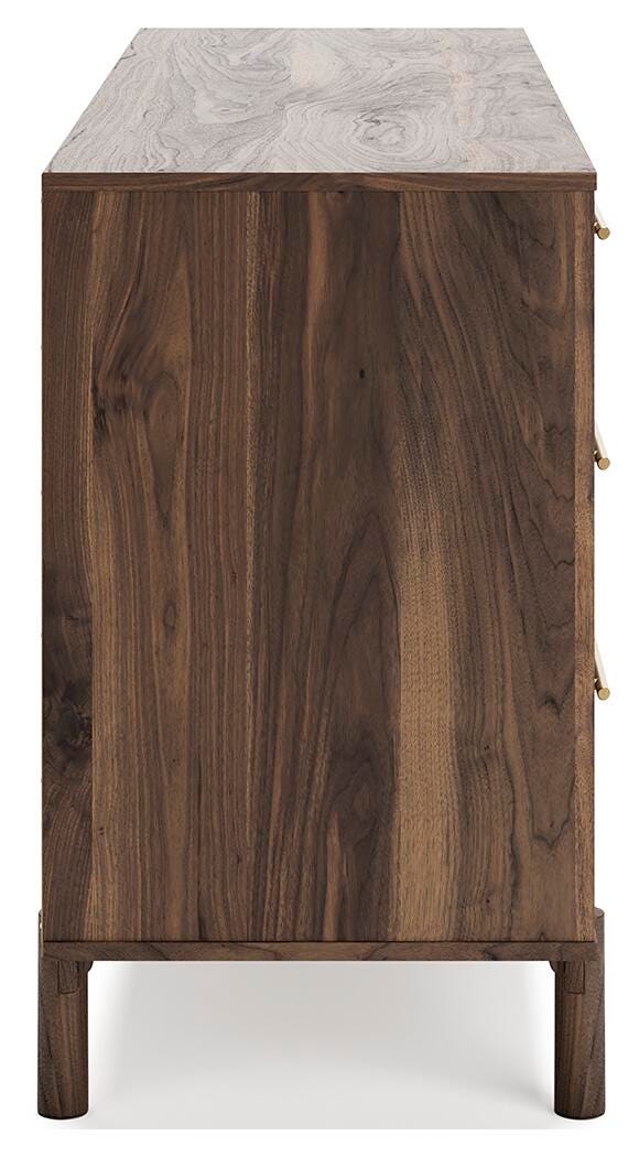 Ashley Furniture Calverson dresser with multiple drawers and a warm wood finish, shown from a side view.