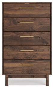 Ashley Furniture Calverson chest of drawers with a sleek wooden finish and multiple storage drawers, head-on view.