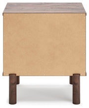 Ashley Furniture Calverson Nightstand with dark wood finish and sleek design, featuring drawer handles and a sturdy top surface.