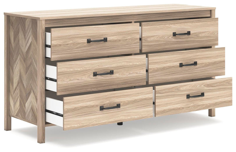 Ashley Furniture Battelle Dresser with open drawers, showcasing spacious storage and modern wood finish from an angled view.