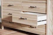 Ashley Furniture Battelle Dresser featuring multiple drawers and a sleek wood finish for stylish bedroom storage.