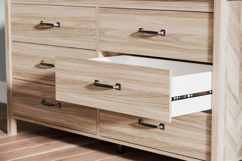 Ashley Furniture Battelle Dresser featuring multiple drawers and a sleek wood finish for stylish bedroom storage.