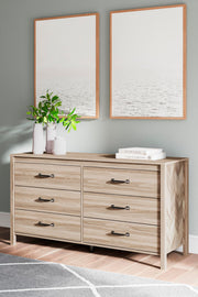 Ashley Furniture Battelle Dresser with multiple drawers and sleek wood finish, ideal for modern bedroom storage.