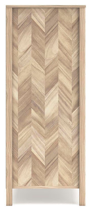 Ashley Furniture Battelle Chest of Drawers showing a modern wooden chest with multiple drawers and sleek design.