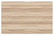 Ashley Furniture Battelle Chest of Drawers with a sleek top surface and multiple drawers for storage.