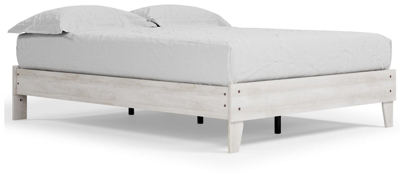 Ashley Furniture Shawburn Queen platform bed with a sleek wooden frame and neutral finish, shown from an angled side view.