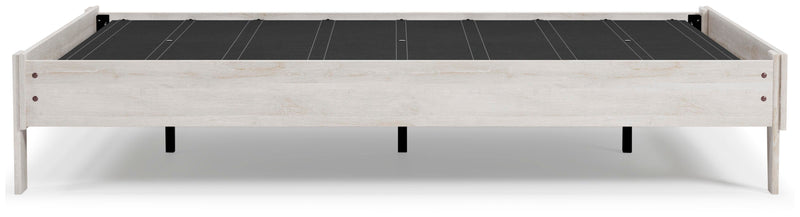 Ashley Furniture Shawburn Queen Platform Bed with a sleek wood frame and modern design, shown from a side angle.