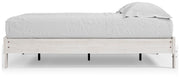 Ashley Furniture Shawburn Queen Platform Bed with sleek wood finish and modern design, shown from a side angle.