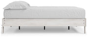Ashley Furniture Shawburn Queen Platform Bed with a sleek wooden frame and side view, showcasing modern bedroom furniture design.