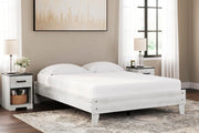 Ashley Furniture Shawburn Queen Platform Bed with wood frame and modern design, shown in a bedroom setting.