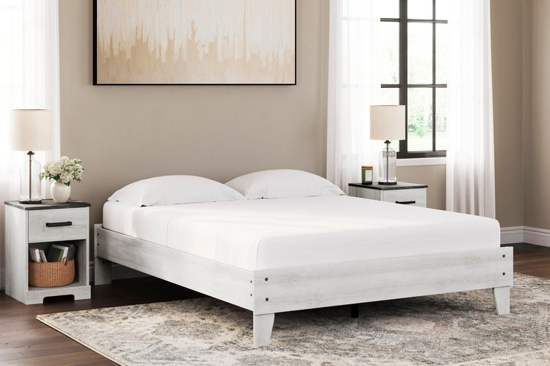 Ashley Furniture Shawburn Queen Platform Bed with wood frame and modern design, shown in a bedroom setting.