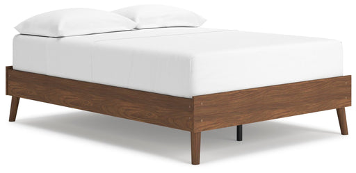 Ashley Furniture Fordmont Bed with a sturdy wooden frame, shown from a side angle in a cozy bedroom setting.