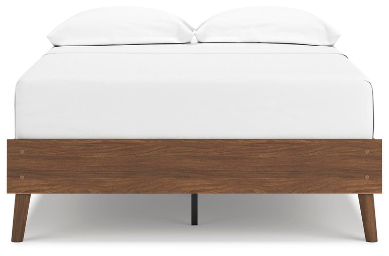 Ashley Furniture Fordmont Bed with a sleek headboard and dark wood finish, shown from a front head-on view.