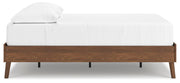 Ashley Furniture Fordmont Bed with a sleek wooden frame and side panel design, shown from a side view in the image.