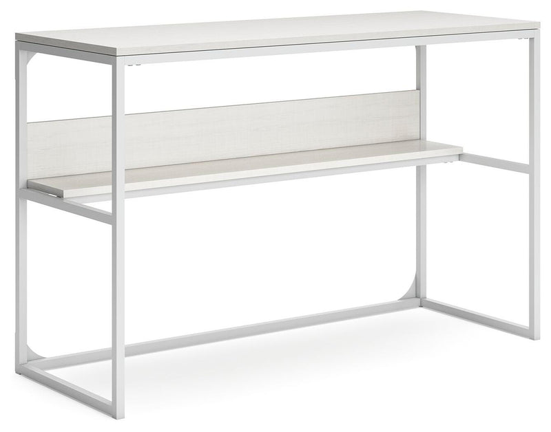 Ashley Furniture Deznee home office desk shown from an angled view, featuring a sleek wooden surface and modern design.
