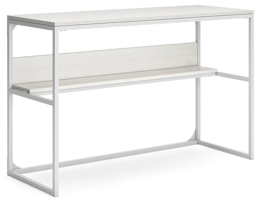 Ashley Furniture Deznee home office desk shown from an angled view, featuring a sleek wooden surface and modern design.
