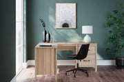 Ashley Furniture Battelle 60-inch home office desk with return, showcasing a modern wooden desk with ample workspace and storage.