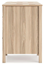 Ashley Furniture Battelle 60-inch home office desk with a sleek wooden surface and modern design, shown from a side angle.