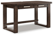 Ashley Furniture Breckington Home Office Set with a desk and matching chair, shown from an angle in a modern workspace setting.