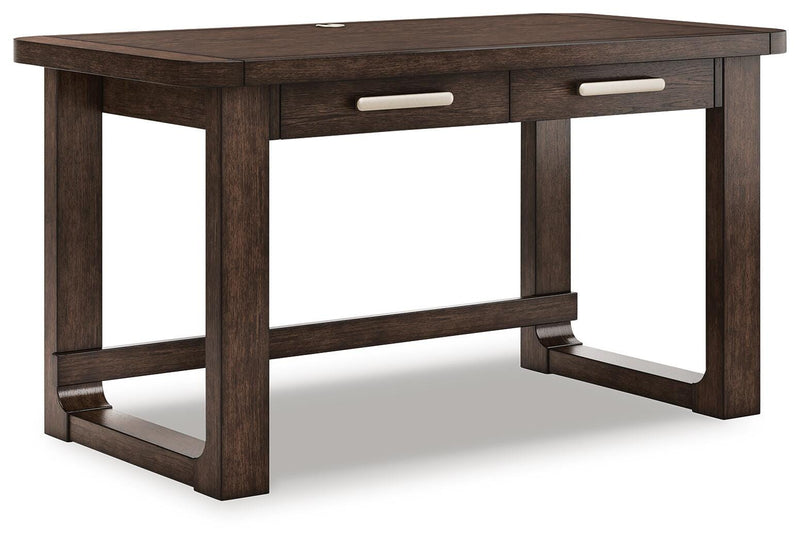 Ashley Furniture Breckington Home Office Set with a desk and matching chair, shown from an angle in a modern workspace setting.