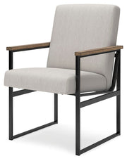 Ashley Furniture Montia home office set with desk, chair, and storage, shown from an angled view.