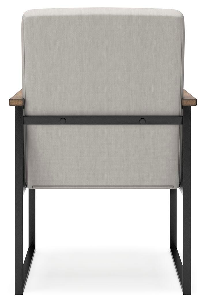 Ashley Furniture Montia home office set with a desk and matching chair, shown from the back in a modern workspace.