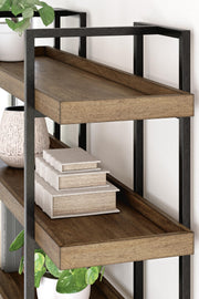 Ashley Furniture Montia home office set with desk, chair, and storage shelves arranged in a modern workspace.