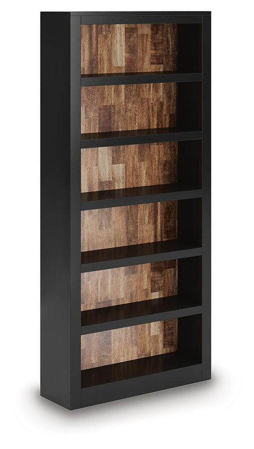 Wildenauer 75-inch wooden bookcase by Ashley Furniture with multiple shelves shown from a side angle.