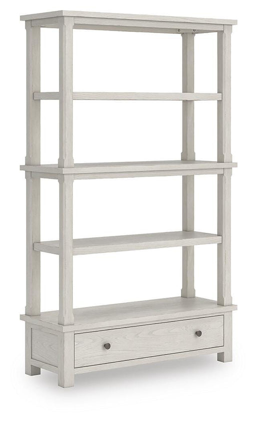 Ashley Furniture Robbinsdale 75-inch bookcase with multiple shelves and wood finish, shown from an angled side view.