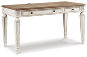 Ashley Furniture Realyn home office set with a desk, chair, and storage units shown from an angled view.