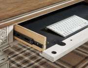 Ashley Furniture Realyn home office set with desk, shelves, and storage units shown in detailed view.