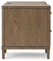 Ashley Furniture Roanhowe Home Office Set with desk, chair, and storage units arranged in a modern home office space.