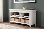 Ashley Furniture Kanwyn Credenza curio cabinet with glass doors and wooden finish, showcasing display shelves and storage compartments.