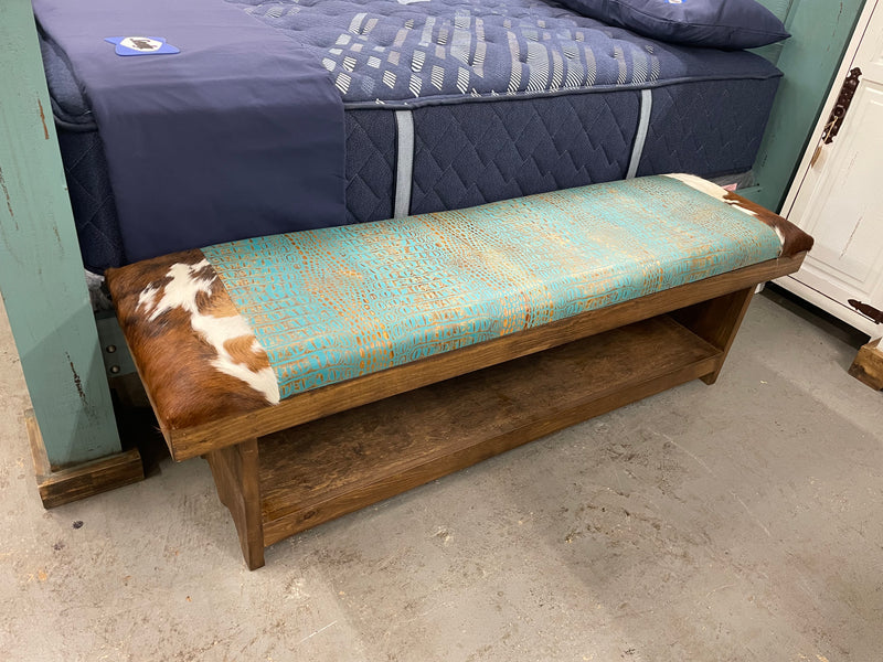 Western-style 5ft bench with cowhide and embossed leather, handcrafted by Monterrey Furniture, showcasing rustic design and craftsmanship.