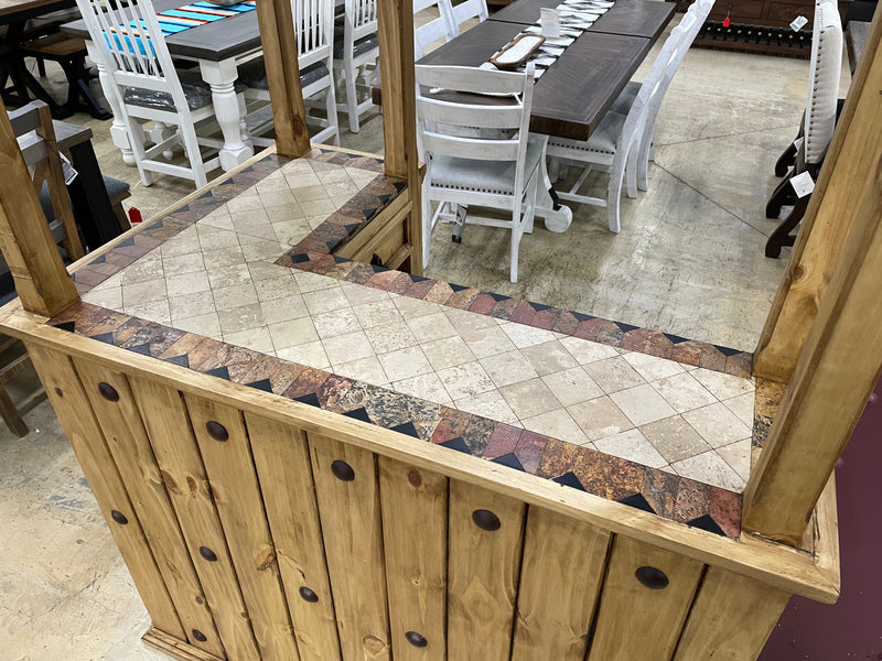 Rustic solid wood cantina bar with travertine top, crafted by Monterrey Furniture, showcasing natural wood grain and elegant surface.