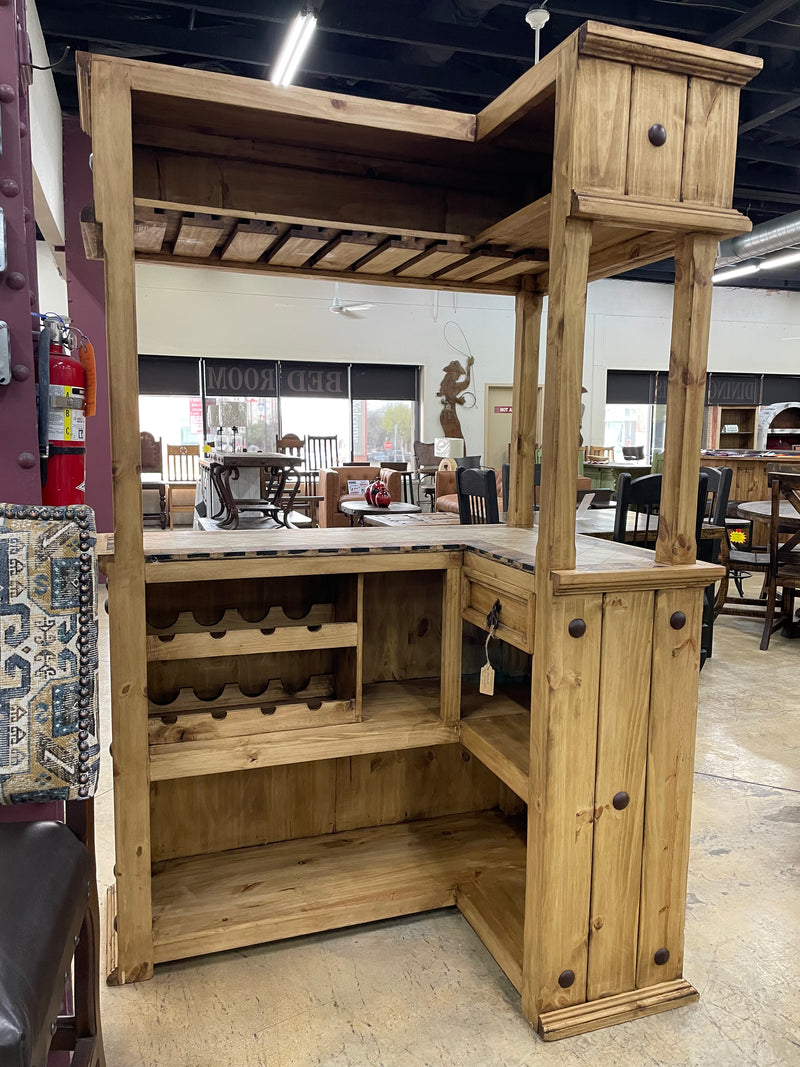 Rustic solid wood cantina bar with travertine top, handcrafted by Monterrey Furniture showcasing natural wood grain and elegant stone surface.