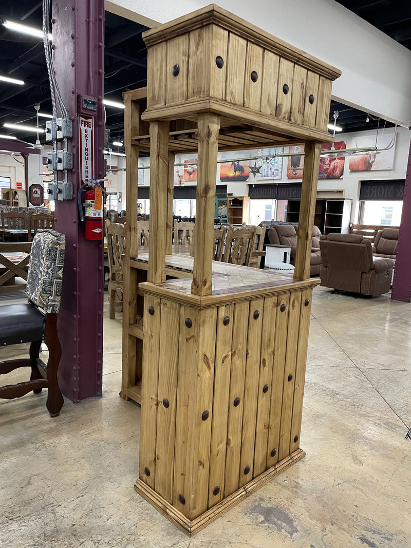 Rustic solid wood Monterrey Furniture bar with travertine top, showcasing a sturdy, stylish cantina bar for home or commercial use.