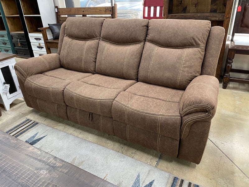 Three-piece manual reclining living room set by Monterrey Furniture, including sofa and armchair with plush upholstery.