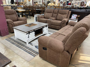 Three-piece manual reclining living room set with plush cushions and dark upholstery by Monterrey Furniture.