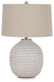 Ashley Furniture Jamon table lamp with a sleek design, featuring a stylish base and a fabric lampshade for modern home decor.