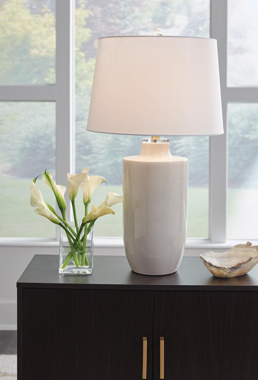 Ashley Furniture Cylener Lamp Set featuring two modern table lamps with fabric shades and sleek bases on a wooden surface.