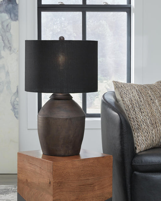 Ashley Furniture Naareman table lamp set with two stylish lamps featuring neutral shades and modern bases on a wooden surface.