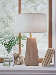 Ashley Furniture Dellner table lamp with a sleek base and fabric shade, perfect for modern living room or bedroom decor.