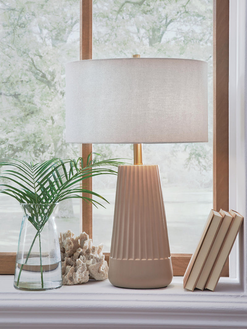 Ashley Furniture Dellner table lamp with a sleek base and fabric shade, perfect for modern living room or bedroom decor.