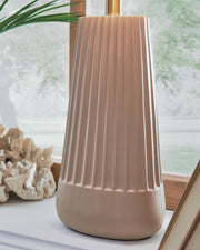 Ashley Furniture Dellner table lamp with a sleek design, featuring a fabric shade and wooden base for modern home décor.