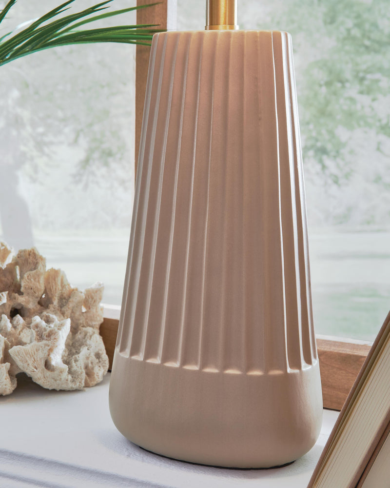 Ashley Furniture Dellner table lamp with a sleek design, featuring a fabric shade and wooden base for modern home décor.