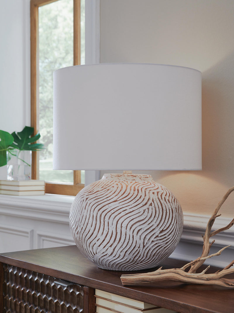 Ashley Furniture Vien table lamp with a stylish base and fabric shade, perfect for adding warm lighting to any room.