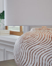 Ashley Furniture Vien table lamp with a sleek base and fabric lampshade, perfect for modern home decor.