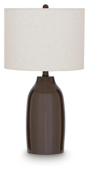 Ashley Furniture Jyler table lamp with a sleek black base and white fabric shade on a wooden side table.